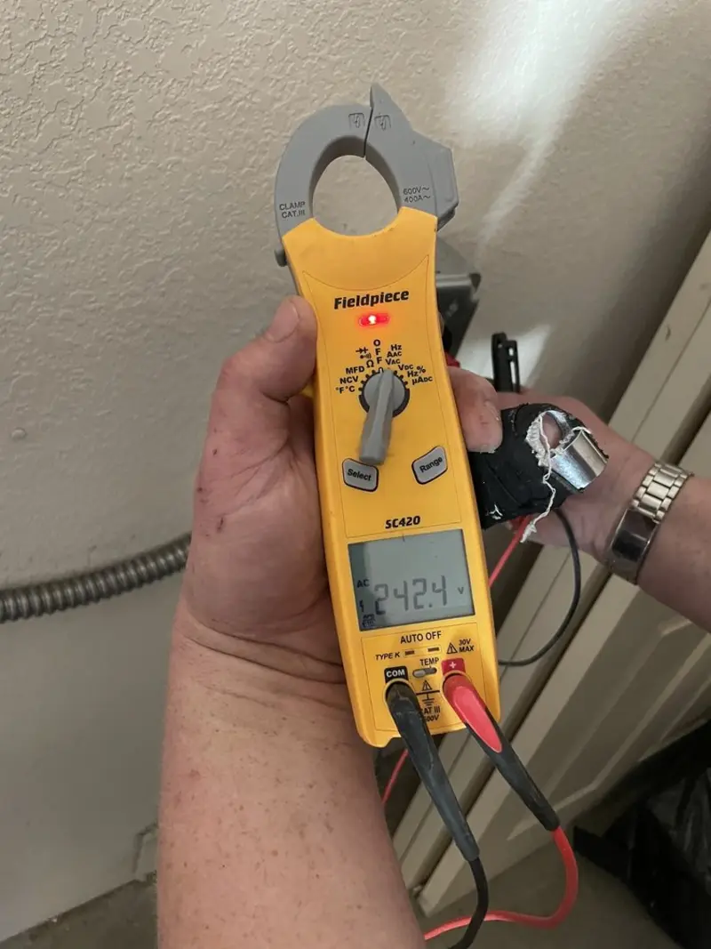 Voltage testing with clamp meter during Aluminum Wiring Replacement in The Pinery